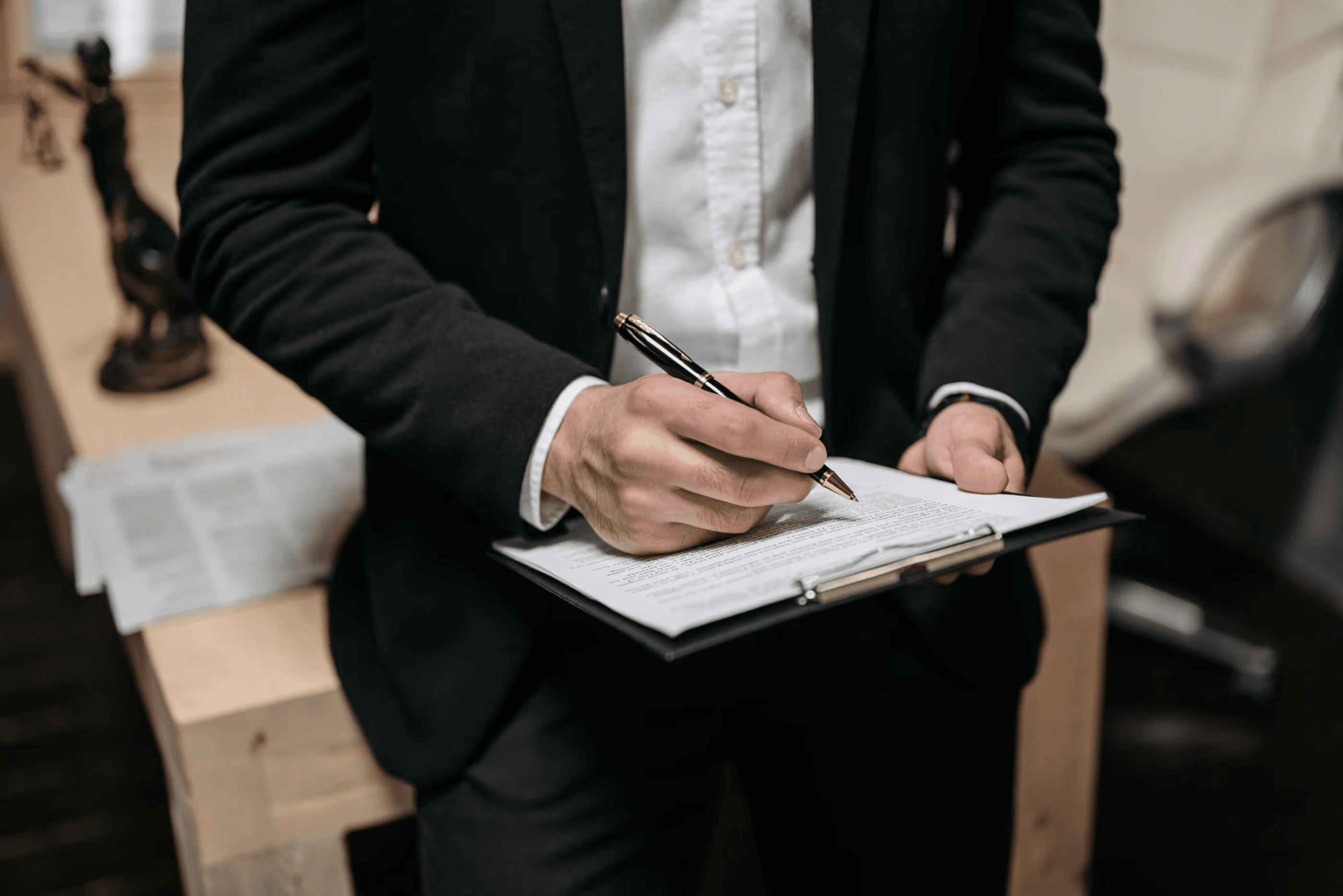 Lawyer signing documents